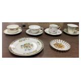 4 cups and saucers. 2 plates look at photos
