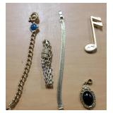 3 bracelets, 1 charm and 1 pin all costume