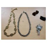 2 necklaces, 2 clip set earrings & 1 pin costume