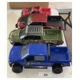 A LOT OF PLASTIC TOY TRUCKS / SHIPPING
