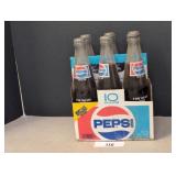 Six pack of Pepsi bottles and carton / shipping