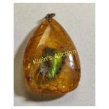 gemstone pendant in amber rare ammolite