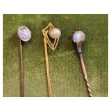 stick pins 2 are 14K & one is not shield & pearl