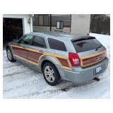 #9 This vehicle has a bluish-grey exterior paint with custom 3M vinyl wood paneling