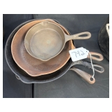 #792 Lot of 4 Wagner Ware Sidney Cast Iron Skillets Incl. 3E, 21056 J, 10580, and 1099