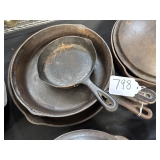 #798 Lot of 4 Cast Iron Skillets Incl. Favorite Piqua Ware 3A, 10, 0, and Wagner Ware Sidney