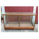 #352 Lg. display case w/ glass shelves