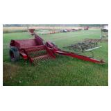 Pull behind hydraulic stone picker