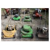 Several lawn mowers