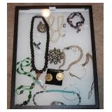 #66 brooches, large black beads, etc. 