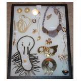 #71 Misc. jewelry in glass display