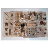 #75 Lot of packaged pins, rings, etc.