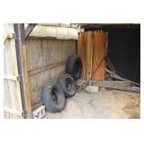 several tires and wood fencing