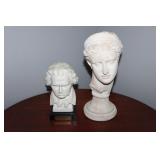 2 marble looking busts