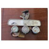 Several mirrors, clocks, gauges, etc.