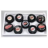 #597 Lot of 9 Detroit Red Wings Signed Pucks #597 Lot of 9 Detroit Red Wings Signed Pucks