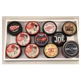 #599 Lot of 11 Detroit Red Wing Commemorative Pucks #599 Lot of 11 Detroit Red Wing Commemorative Pucks
