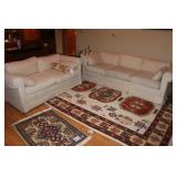 Cream love seat and couch
