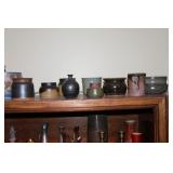 Lots of pottery vases, cups, etc.