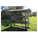 Covered cattle feeder