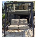 Black Metal Frame Patio Swing with Beige Cushions