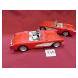 TWO RED CORVETTE CARS POSSIBLY AM/FM RADIOS