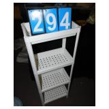 FOUR SECTION SHELF UNIT LOOKS NEW