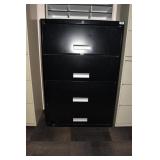 BLACK 4 DRAWER LATERAL W/ DENT ON DOOR