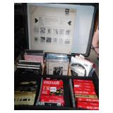 HARD SILVER CASE WITH MISC. DVDS, CASSETTES AND