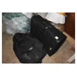 TWO BLACK SUITCASES AND TRAVEL BAGS