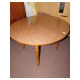 FORMICA 41 1/2" ROUND TABLE WITH MAPLE LEGS