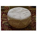 TAN ROUND OTTOMAN TUFTED