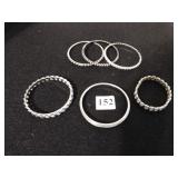 SIX SILVER TONE METAL BANGLE BRACELETS