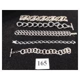 FIVE SILVER TONE METAL BRACELETS