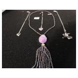 FOUR COSTUME JEWELRY NECKLACES