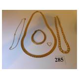 14K GOLD NECKLACE (FAR LEFT IN PICTURE) AND