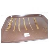 SIX GOLD TONE BRACELETS AND MINI HOOP EARRINGS