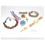 BRACELETS, PENDANT, LARGE BROWN STONE PENDANT ON