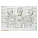 THREE GLASS DISPENSERS W/ PLASTIC STOPPER SEALS