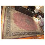 MACHINE MADE RUG 135" X 93" RED W/ BLACK BORDER