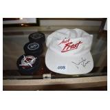 HOCKEY PUCKS AND AUTOGRAPH HAT