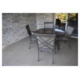 48" ROUND SMOKED GLASS TOP TABLE AND 4 CAST