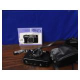YASHICA ME 1 CAMERA W/ BOOK 3 8 MM LENS & FLASH