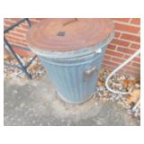 GRASS SEED IN METAL GARBAGE BIN