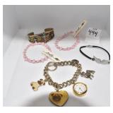 CUFF BRACELET W/ CROSS AND OTHER BRACELETS