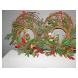 2 WREATHS WITH A CANDLE IN THE MIDDLE 20" H X 20"