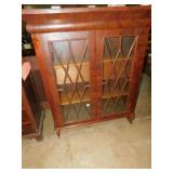 MAHOGANY 2 DOOR ANTIQUE CABINET W/ FRETWORK ON