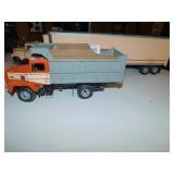 TWO MODEL TRUCKS PINK SEMI AND DUMP TRUCK