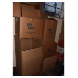 MOVING BOXES ONE FILLED WITH PAPER WARDROBE.