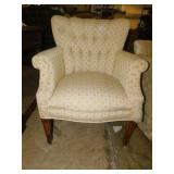 UPHOLSTERED ARM CHAIR HAS SCRATCH MARKS ON BACK.